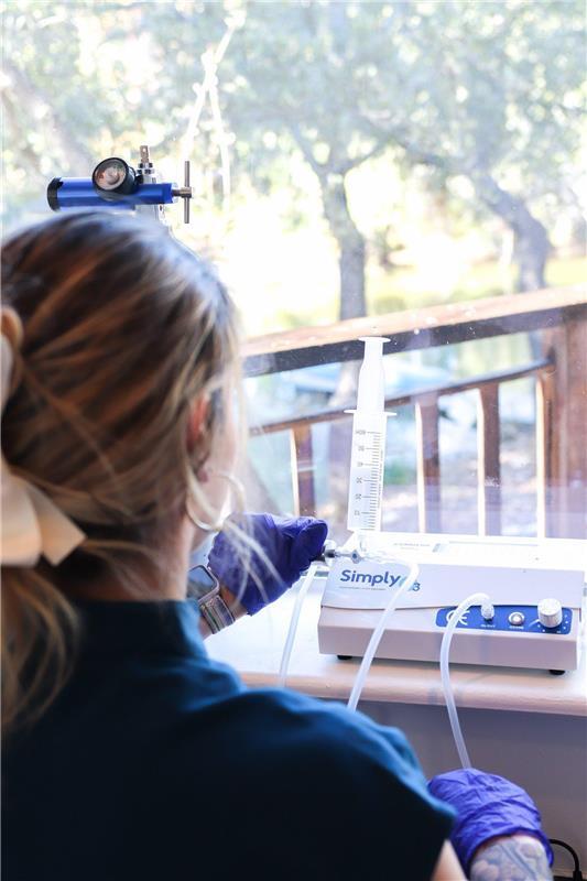 A provider preparing an ozone therapy treatment at Pinnacle Performance Care
